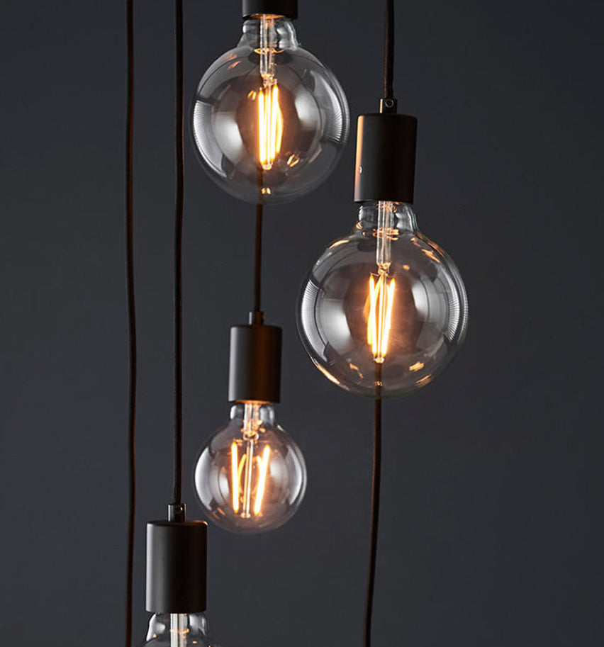 Black pendant holder with tinted bulbs